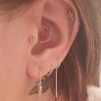 conch, tragus, and helix with opal jewelry