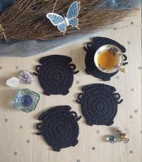 Made to order. We could all use a little bit of magic in our daily routine, and these coasters will do the trick!  These unique cauldron coasters are black in color and come in a set of four. If you love these, be sure to check out the WhichCraftCJP cauldron purse too!  Measurements: Approximately 4.5 inches wide and 5 inches tall (including the feet). Note each cauldron is handmade and my vary slightly in size. Yarn and Care Instructions: 100% cotton Spot clean or hand wash with cold water Shap