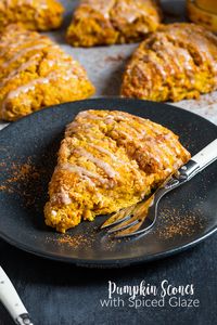 These flaky and buttery Pumpkin Scones are drizzled with a spiced glaze to make one seriously awesome breakfast that will start your day on the right foot!