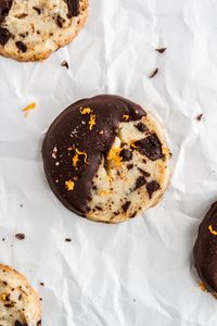 Slice and Bake Chocolate Orange Shortbread Cookies -- a chocolate chunk shortbread cookie recipe flavored with orange zest and dipped in chocolate. SO GOOD. @girlversusdough #girlverusdough #thecookies #chocolatechipcookie