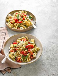 Take your pasta salad to the next level by adding sweet diced tomatoes and mozzarella cheese balls for a light veggie dinner