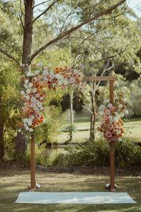 Bright and bold spring time arbour arrangement including roses and and dahlias for Annie and Mitch at the stunning Bawley Vale. Flowers and styling by Nunu designs, Photography by Amber Wynn-Jones