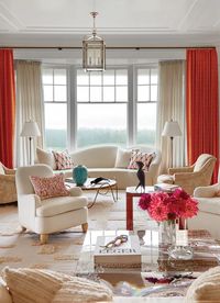 Living room with orange curtains