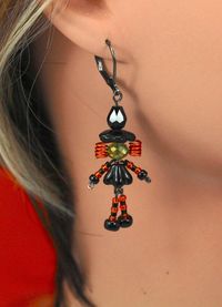 Witch Dangle Earrings  Not So Scary Witches are the perfect companion to any Halloween outfit. Each pair is made with Czech Glass beads, Gun-metal findings, and colored Artistic Wire.   Available Colors:                Pink                Orange                Purple                Blonde The latch back ear wires are lead and nickel free. Free Shipping on orders of $35 or more. (USPS Ground Advantage only) For best results, store Jewelry in the bag provided. *Items are handmade, so each one is u