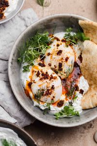 turkish eggs with herbed yogurt sauce and 'nduja! #wellseasoned #brunch #breakfast #eggs #turkisheggs #yogurt #yogurtsauce #nduja #herbedyogurt #eggphotography #yogurtphotography #breakfastphotography #photography #foodphotography #styling #foodstyling #eggstyling #glutenfree #middleeastern #middleeasternbreakfast #glutenfreebreakfast #ndujasauce #spicyeggs #savorybreakfast #savorybrunch #holiday