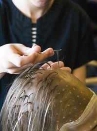 Colorist's Frosting Cap Yields Cute Blonde Highlights on Woman's Hair