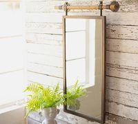 Featuring a distressed, barely-there finish and stunning hardware details, our Cooper Rectangle Wall Mirror offers the charm of a classic farmhouse accent.