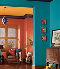 COLOR HARMONY: This is a split-complementary color scheme. The oranges on the back walls and ceiling are not true oranges; one is more red, and the other is more yellow.