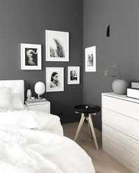 Stylish grey and white Nordic style bedroom.The predominantly white artwork helps lighten up the stone grey walls. - Is To Me