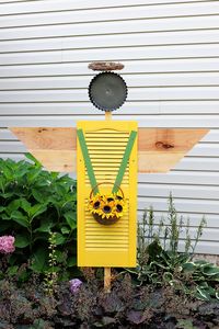 How to make an garden angel by upcycling a vinyl shutter rescued from a thrift store. This cute piece of garden art can also be used as a scarecrow.