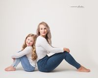 Mother and daughter studio portrait.