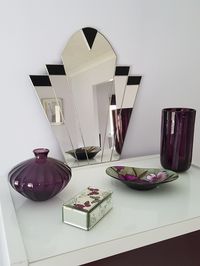 This Art Deco Vintage Style Wall Mirror is handmade with genuine black stained glass, giving it a classic 1930s look.  It can also be customised in the colours of your choice and I can provide glass samples to help with your choice.  Add a touch of classic elegance with this beautiful Art Deco inspired mirror to any room in your home including the bathroom, or gift it to a friend or relative for that special occasion or celebration. The back is protected with black velour and it comes with a wir