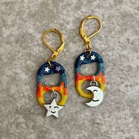 Love you to the moon and back! Enjoy your starry nights with these hand painted earrings featuring cute star and moon charms and lever back closures. You can see the optional matching bracelet here: https://www.etsy.com/listing/550839941/sun-and-moon-soda-pop-tab-bracelet-blue?ref=shop_home_active_22&sca=1 I use lever back closures on all my earrings because they close easily and are harder to accidentally lose. All items are handmade by me in my smoke free, pet friendly home, and available to s