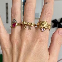 Rings that tell tales of love, luck and magic. Inspired by ancient, lucky talismans but designed with a modern twist. Style your fingers with statement signet rings, delicate hearts and colourful gemstones.