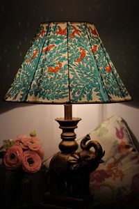 This beautiful floor Lamp  is Hand painted with Island Forest Theme, the colouring on this shade is Nature inspired, sure to bring a warm glow to your room. The light diffuses through the chiselled small holes in decorative pattern gives an appearance of rich ornamentation against a lit backdrop. The pattern continues right around the lampshade, the top and bottom edges are sieved with leather. PRODUCT INFORMATION Brand : CHAYAA Height - 10 inches  Width - 16 inches  Top - 8 inches   Not included: Lamp  Fitting: Euro/UK/Aus/ Canada                        I recommend using low energy bulbs with the lampshades as they use less energy and will create a relaxed and cozy ambiance. International Customers please inbox your mobile number for courier purposes.  Please check my shop for other beaut