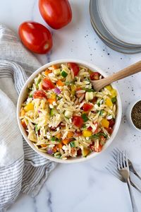 Rainbow Orzo Salad is a bright and colorful salad that's perfect for warmer weather. It's crunchy, light and fresh. This easy pasta salad is the perfect side dish or light lunch. Simple to make and ready in less than 30 minutes.