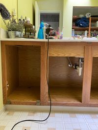 Painting the bathroom vanity, inside and out. We wanted to get the most bang for our buck with resale value when we undertook this bathroom project. Every relator we talked with said painting inside of cabinets is a must with a vanity refresh. #vanity #bathroomrefresh #bathroomremodel