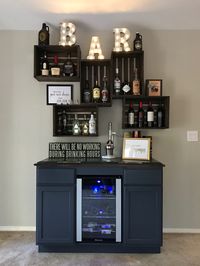 DIY bar with wine fridge and vintage crates.