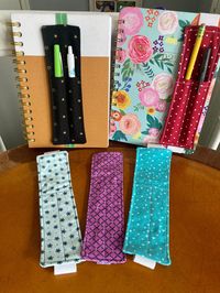 "The perfect addition to any journal, notebook, planner, bible, or book. Keep your writing utensils close to write and markup whatever you are working on. This makes a great gift for all ages!  100% cotton fabric with a divided pocket. Holds 2-3 standard pens, pencils, highlighters. Size: 7 1/2\" long by 2\" wide Fits books up to 10\" long Care: Handwash, lay flat to air dry, fabric can be ironed, avoid ironing elastic Looking for a certain color of fabric or elastic, or longer elastic, or different width? Message me for a custom order - I am happy to accommodate!"