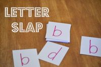 There's been a little confusion between little d and little b around our house.  So here's a fun game to help get them straight:  Letter Slap -- A Game for Discerning Letters