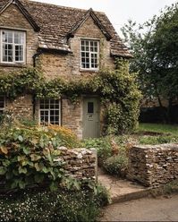 Step into a storybook with this charming stone cottage enveloped in lush ivy. Ideal for those who dream of rustic, peaceful retreats in the countryside. #StoneCottage #RusticCharm #CountryLiving