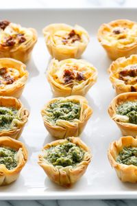 Perfect for Easter brunch! Mini Quiche Bites (Pesto & Chorizo variations!) with ultra-flaky phyllo crust #recipe.