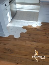 This custom blend of engineered hardwood and hexigon (honeycomb) tile makes for a fun and unique flooring layout.