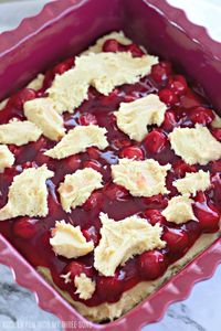 Sweet and chewy homemade cherry pie bars are an easy dessert with a soft sugar cookie crust and delightfully tart and gooey cherry filling.