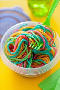 Add food coloring to individual pots of boiling water. Cook pasta as directed, drain and rinse separately. Toss and get ready to swirl - birthday pasta