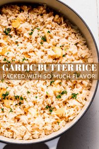 Ordinary white rice is transformed into the best savory side dish in this Garlic Rice recipe! Super fluffy and loaded with garlic and butter, one taste and you’ll never settle for blah rice again. // pilaf // garlic butter rice