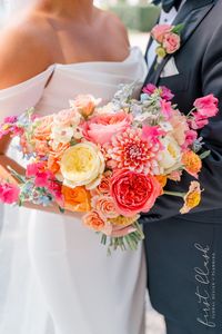 Brighten up your garden wedding with a stunning bridal bouquet featuring a lively mix of yellow and pink blossoms. This vibrant arrangement adds a touch of cheer and romance, perfectly complementing the colorful ceremony and creating a radiant focal point for your special day