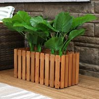 Show off your green thumb with this quaint outdoor wooden planter box. The picket fence style of this planter adds simple style and is perfect for containing your favorite flowers, herbs, veggies and other plants. It is durably constructed of meranti wood with an attractive teak oil finish that enhances the natural beauty of the material.