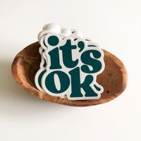 "There is a little mantra I like to tell myself when things start to feel overwhelming: it's ok, you're ok. You're doing this! Designed by me and printed in the US in a dark teal color with an off white background. Thick, durable vinyl protects stickers from scratches, water & sunlight. Perfect for water bottles, laptops, phone cases or your car. Measures approximately 3\" x 3\". Made in U.S.A."