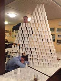 pranking sleeping friend, stacking cups