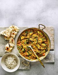 Cook aubergine pieces with fragrant spices and red lentils for a hearty yet healthy vegan curry