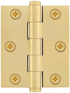 a brass plated door hinge with four knobs