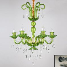 a green chandelier hanging from the ceiling