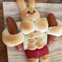 a hot dog with buns in the shape of a man's torso and arms