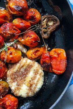 some food is cooking in a skillet on the stove and ready to be eaten