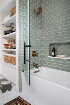 a bath room with a tub and a rug