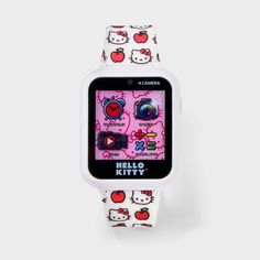 a hello kitty watch with an apple pattern on the front and white strap around it