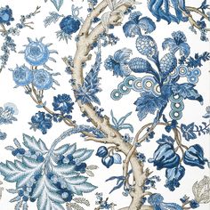 a blue and white wallpaper with flowers and leaves on it's side,