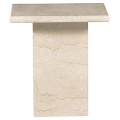 a white marble table with a rectangular top