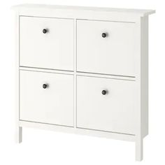 a white dresser with four drawers