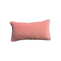 a pink pillow on a white background