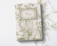 a book with an image of a woman and flowers