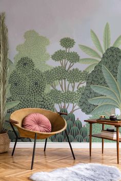 a chair and table in front of a wall mural