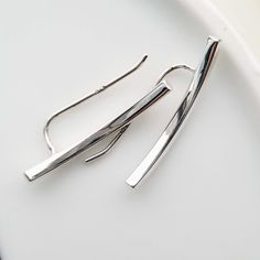 Sterling Silver Bar Ear Climbers Simple earrings to add to any outfit for any time of the day or week. >Metal: 925 Sterling Silver >Hallmark:925 >Size: 2x25 mm These earrings are sold as a set (2 pieces as shown in picture) >Nickel Free >Tarnish Resistant >No Allergic reaction >30 days return policy ++Items come in a gift box ready to be gifted Please contact me if you have any questions about the jewelry you are interested in buying. My Shop: https://www.etsy.com/shop/banuj Ear Bar, Square Bar, Ear Pins, Ear Climbers, Silver Bar, Silver Bars, Bar Earrings, Simple Earrings, Bobby Pins