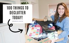 a woman is holding a box full of clothes and shoes with the words, 100 things to declutter today