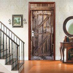 a wooden door sitting next to a set of stairs